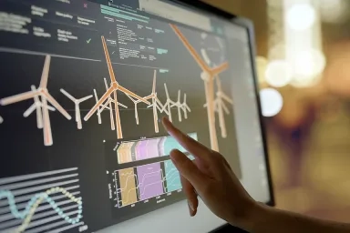 Pointing to a screen showing various energy measurements